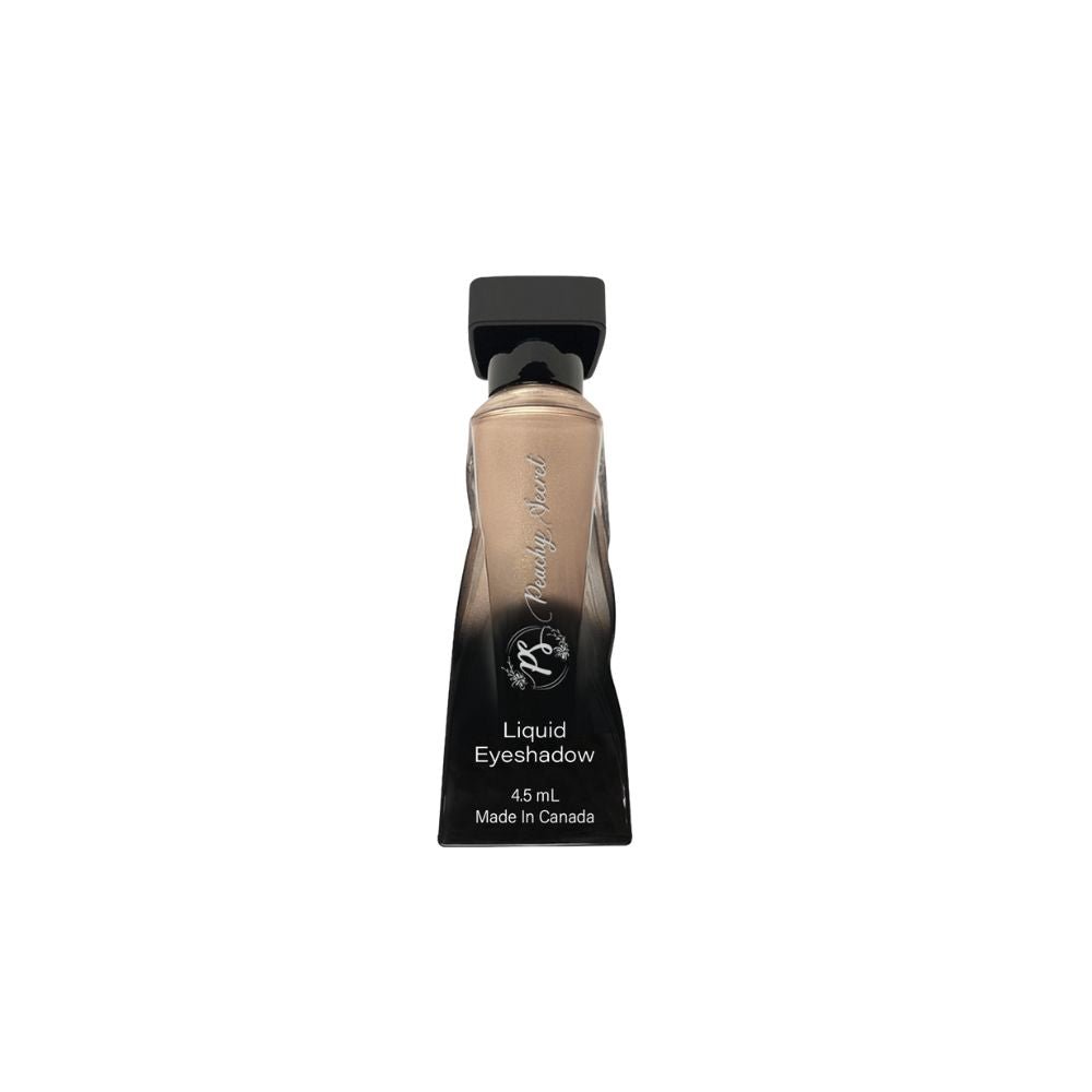 Liquid eyeshadow tube with warm tan shade and black cap