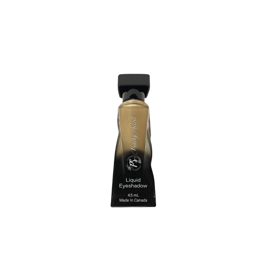 Liquid eyeshadow tube with metallic bronze-gold shade and black cap