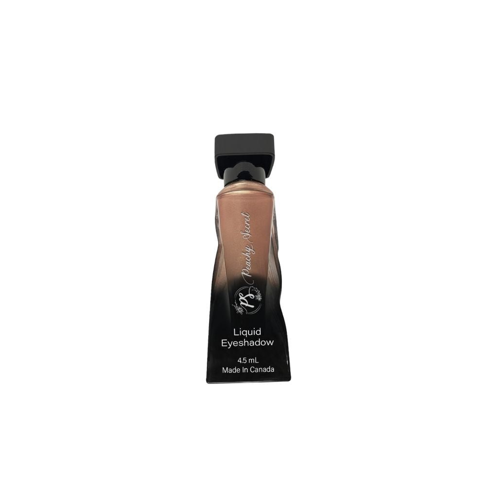 Liquid eyeshadow tube with medium brown shade and black cap