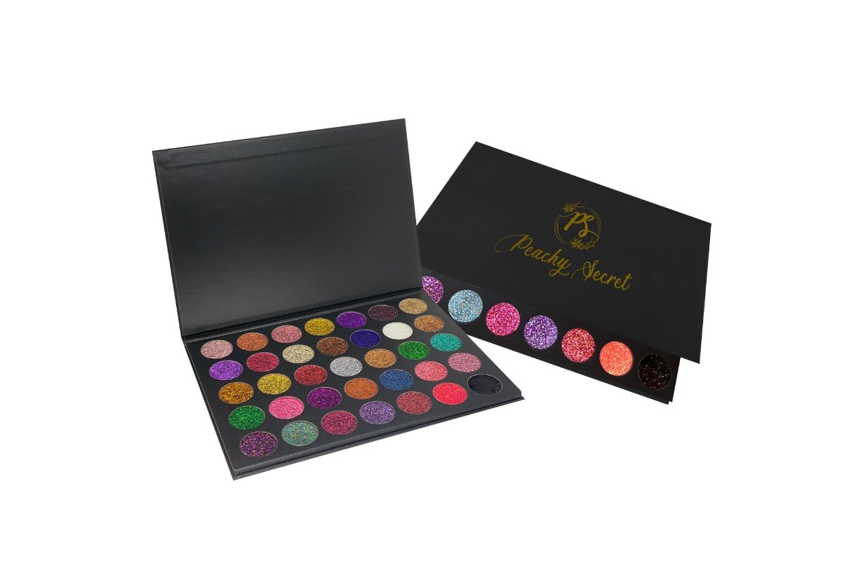 Glitter eyeshadow palette open, featuring multicolor shimmer pans in a black case