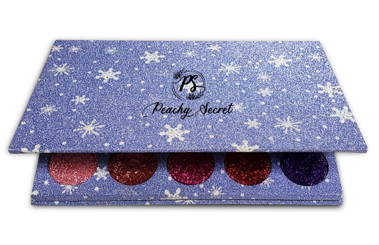 Blue star-pattern glitter eyeshadow palette case with stacked trays and visible shades
