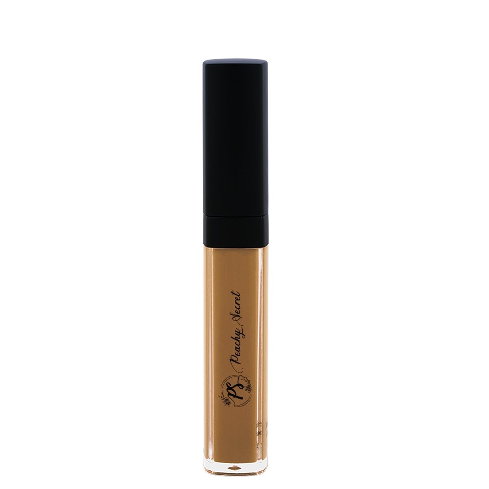 Liquid concealer in warm medium beige in clear tube with black cap