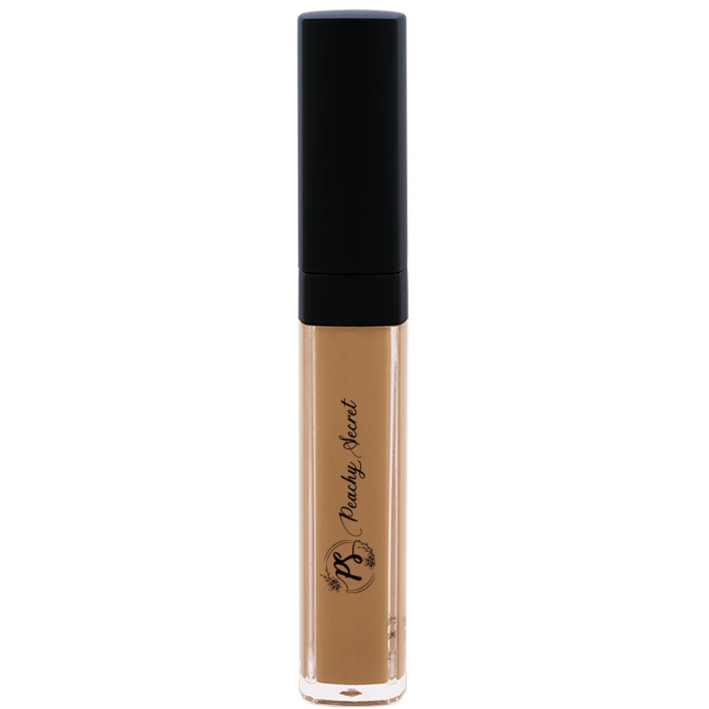 Liquid concealer in warm beige in clear tube with black cap