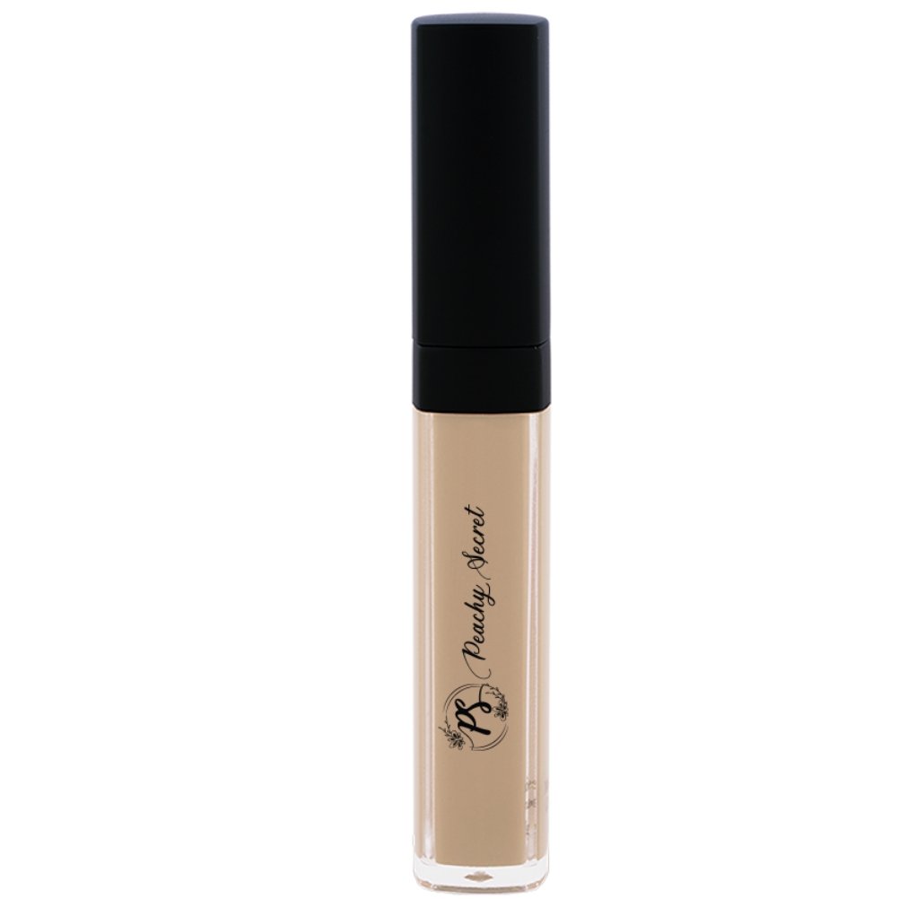 Liquid concealer in light beige in clear tube with black cap