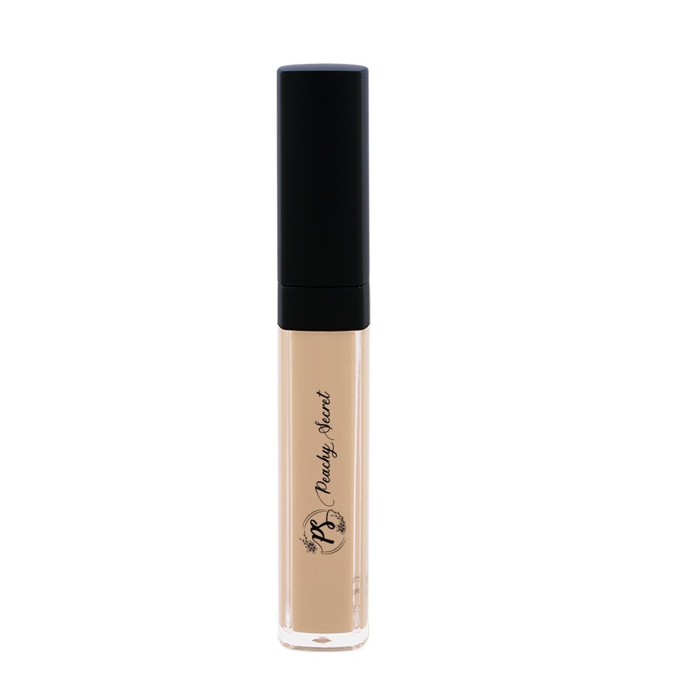 Liquid concealer in light tan in clear tube with black cap