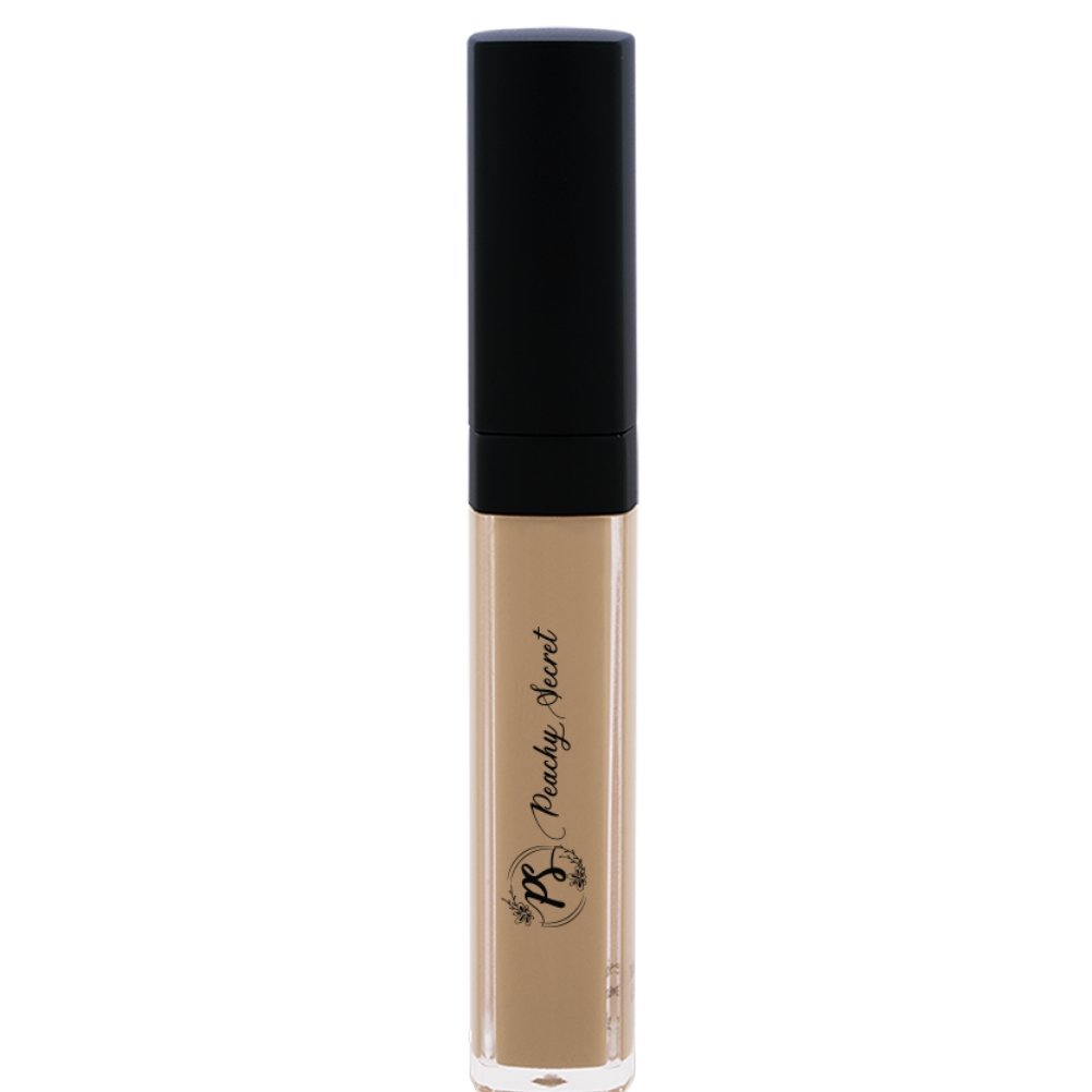 Liquid concealer in warm beige in clear tube with black cap