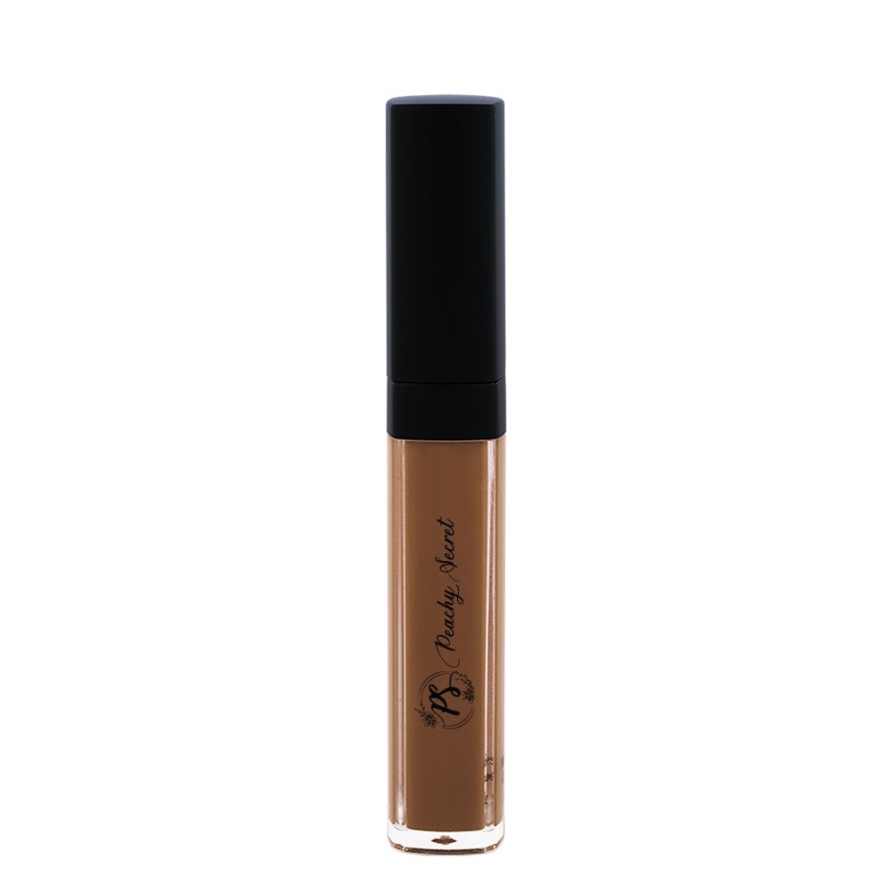 Liquid concealer in deep taupe-brown in clear tube with black cap
