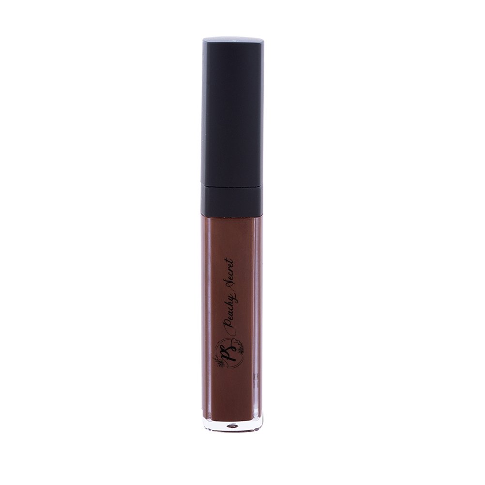 Liquid concealer in reddish brown in clear tube with black cap