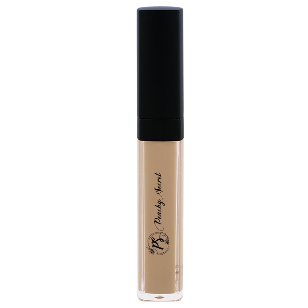 Liquid concealer in pale beige in clear tube with black cap