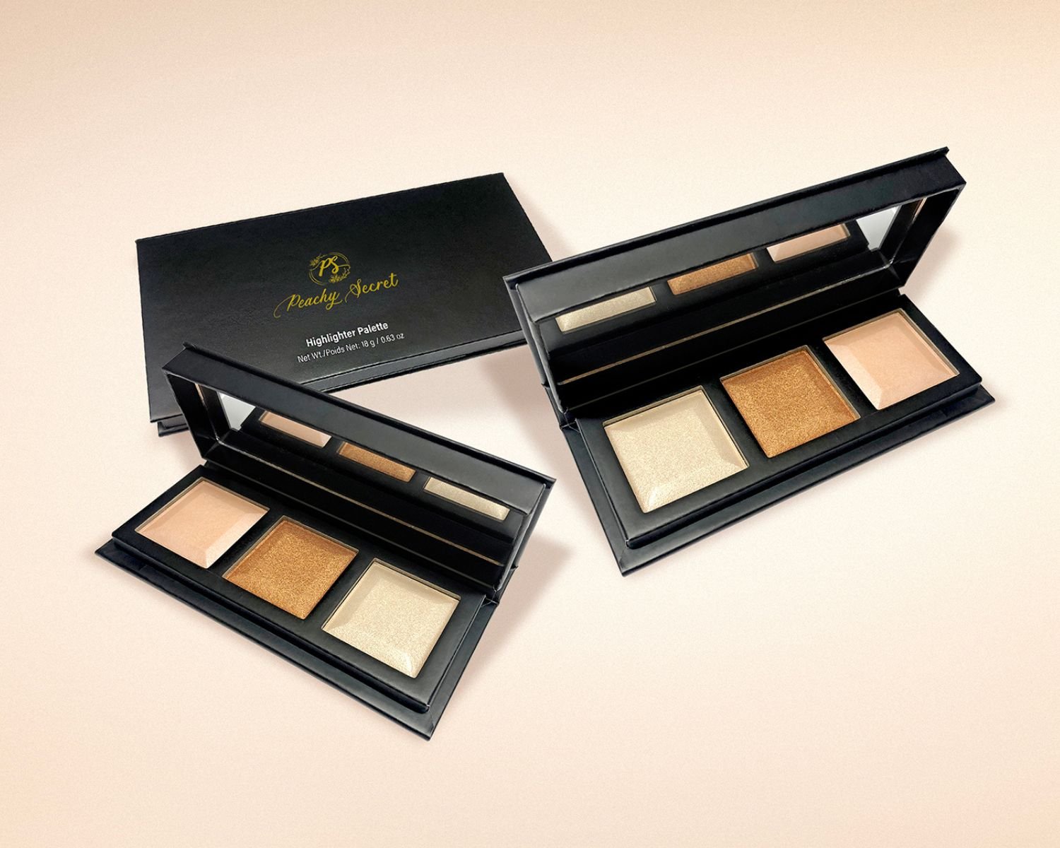 Highlighter palette open with four shimmer pans in a black case.