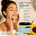 Facial scrub jar and woman applying blue exfoliating gel with sunflower flowers