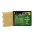 Tea tree oil soap bar in black-and-green box, cream-colored soap bar