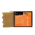Turmeric cleanser soap bar, golden-yellow square bar with boxed label packaging